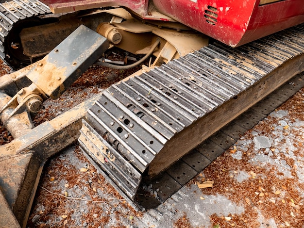 excavator-chains-that-are-rusty-unused-are-just-still-ground_600446-1367 excavator-chains-that-are-rusty-unused-are-just-still-ground_600446-1367
