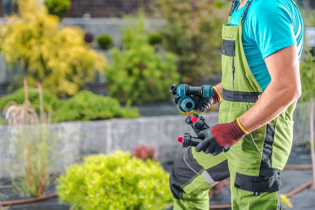 gardener-carrying-components-drip-irrigation-system_1426-22571 gardener-carrying-components-drip-irrigation-system_1426-22571