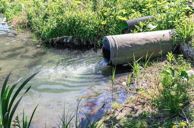 sewage-flows-down-sewer-drainage-pipe-into-river-environmental-pollution_317169-1063
