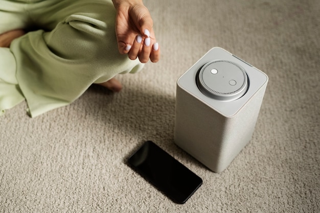 woman-meditating-with-smart-speaker-high-angle_23-2149936254 woman-meditating-with-smart-speaker-high-angle_23-2149936254